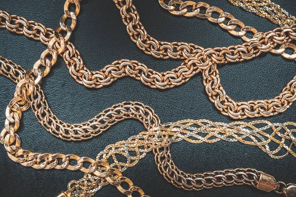 Gold chain for fashionable prints on a dark background, the trend of the 80s, 90s