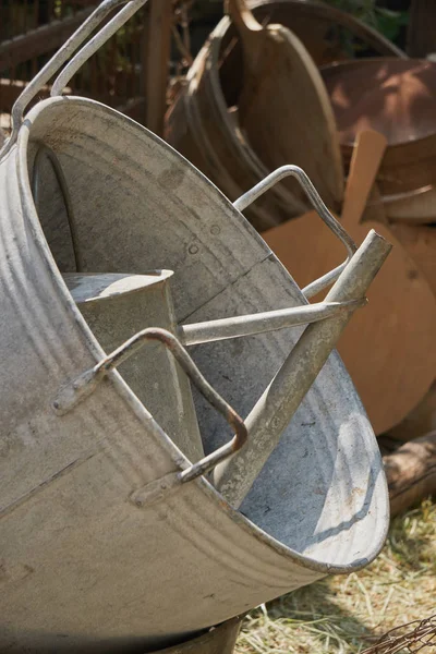 Old vat and watering can in the storage — Stock Photo, Image