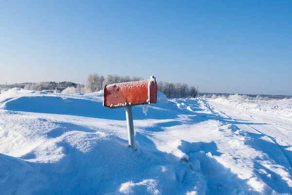 winter frozen mail box under snow