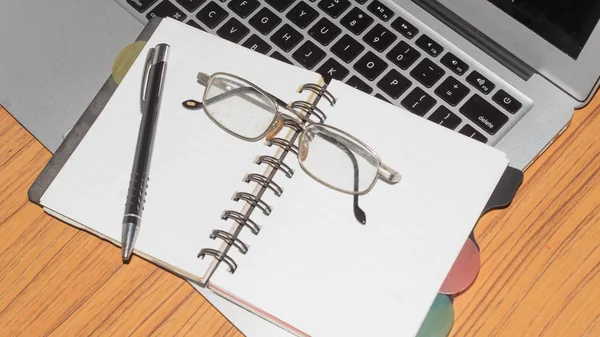 Desk Open Notebook Pen Eye Glasses Placed One Another Office Royalty Free Stock Photos