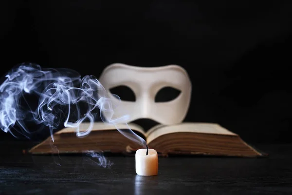 White Classical Venetian Mask Book Extinguished Candle Dark Background — Stock Photo, Image