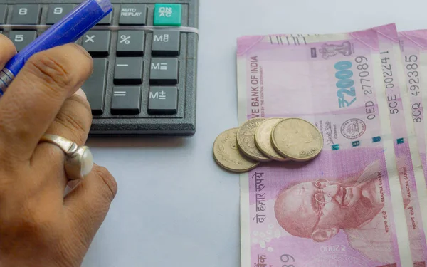 Cropped Hand Woman Checking Account Calculator Holding Pen Indian Currency Stock Photo