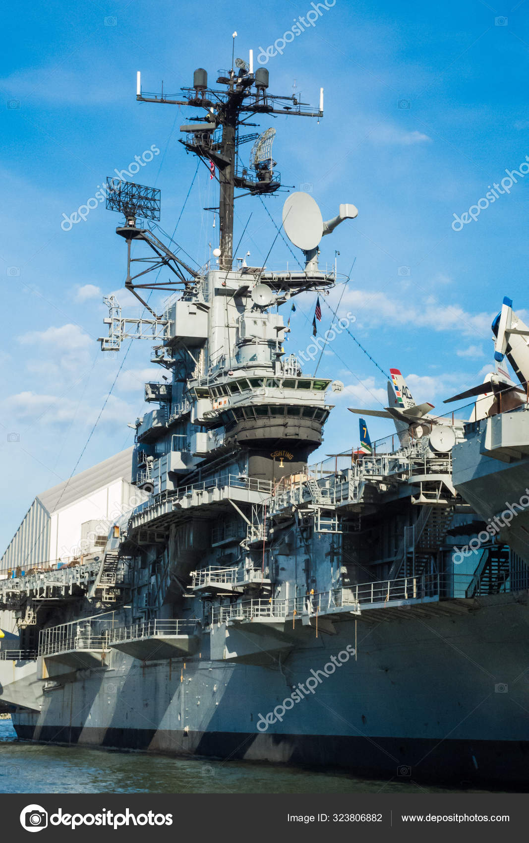 Aircraft carrier control tower steel ship museum blue sky stock photo