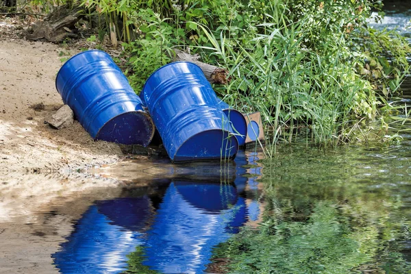 dumped blue oil drums cause pollution in the water, more and more the water is polluted by throwing away waste which therefore gets into the rivers