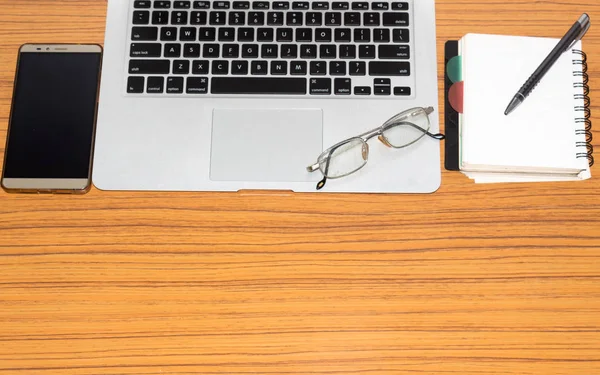Desk Open Notebook Mobile Phone Eye Glasses Placed Office Table Royalty Free Stock Photos