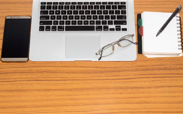 Desk Open Notebook Mobile Phone Eye Glasses Placed Office Table Royalty Free Stock Images