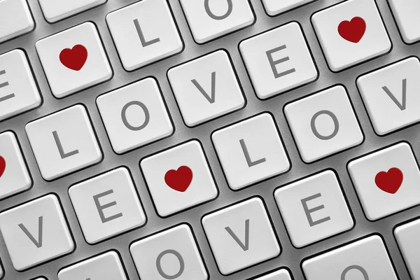 Word Love spelled on each key of a computer keyboard