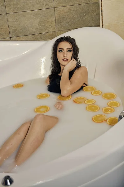 Woman in bathtub photography