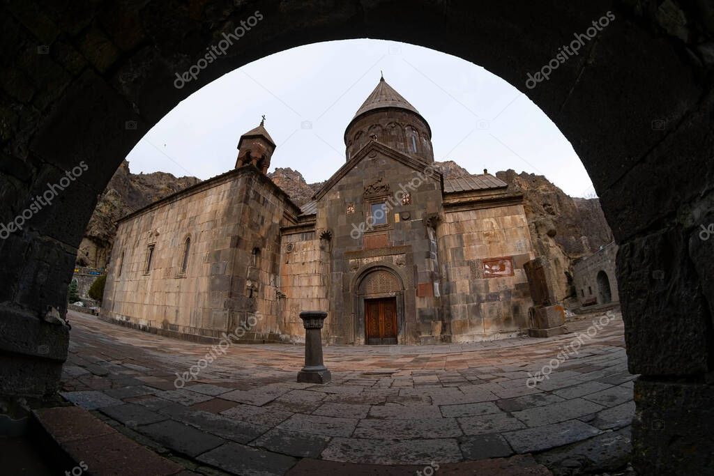 Geghard is a medieval monastery in the Kotayk province of Armenia, being partially carved out of the adjacent mountain, surrounded by cliffs