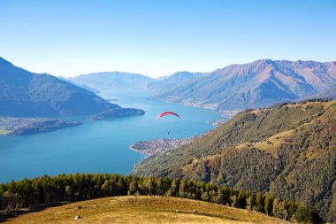 Lake Como (IT) - Paragliding flight over Gera Lario clipart
