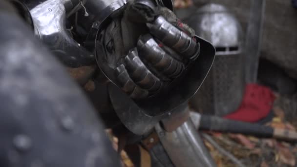 The warrior squeezes his hand into a fist in a gloved hand — Stock Video