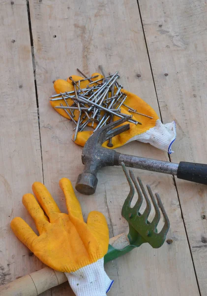 close-up construction tools and hardware material on wooden background