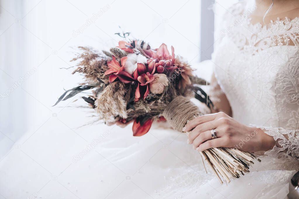 The bride and the flowers in her hand
