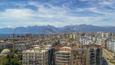 Antalya city view with mountain and cloudy skies clipart