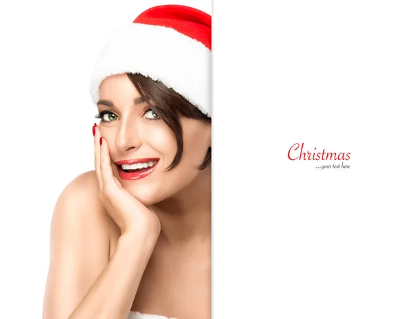 Christmas woman. Beauty model girl in Santa hat — Stock Photo, Image