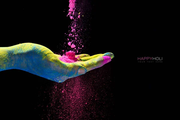 Hand holding colorful powder for holi festival of colors — Stock Photo, Image