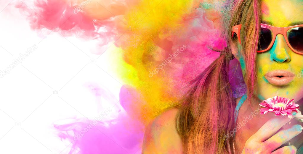 Beautiful young woman celebrating the Holi festival. Colors fest