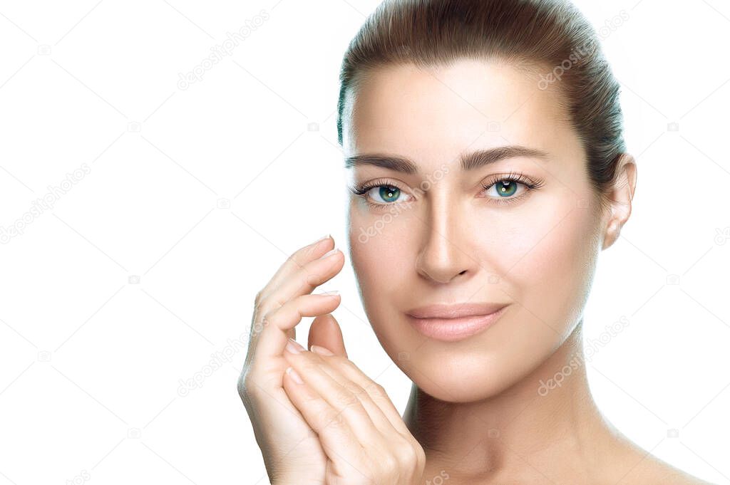 Beauty Spa and Skincare concept. Beautiful model woman face with a flawless fresh clean skin, looking at camera, smiling with a serene expression. Closeup portrait isolated on white