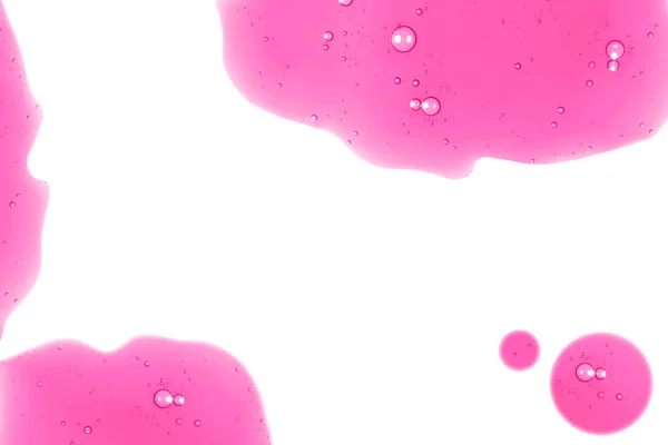 Рожевий Гель Бризкається Крихітними Бульбашками Розкиданими Білому Тлі Концепція Дизайну — стокове фото