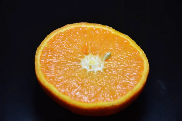 Sliced orange on black background