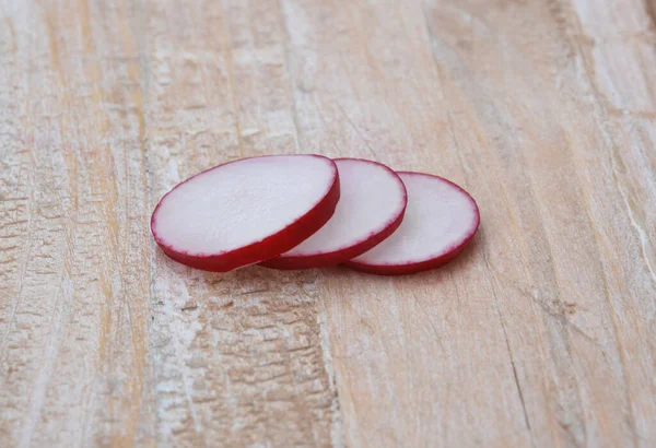 Fresh organic sliced radishes on a plate