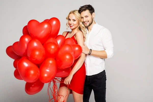 Loving couple with ballons. — Stock Photo, Image