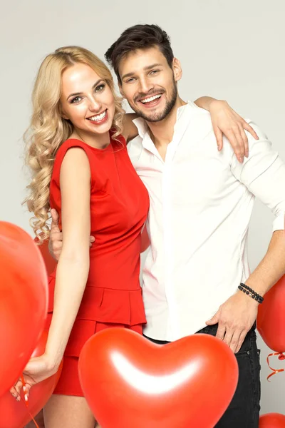 Smiling couple with ballons — Stock Photo, Image