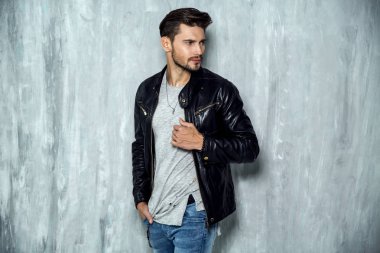 man in leather jacket standing