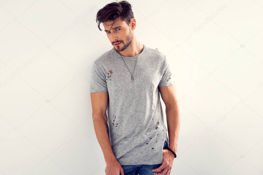 man in black t-shirt flirting at camera