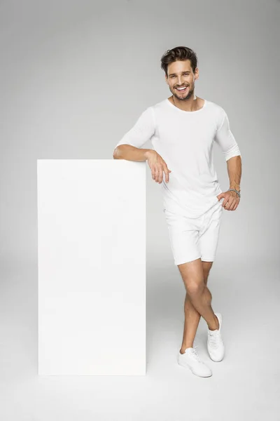 Handsome man in white clothes — Stock Photo, Image