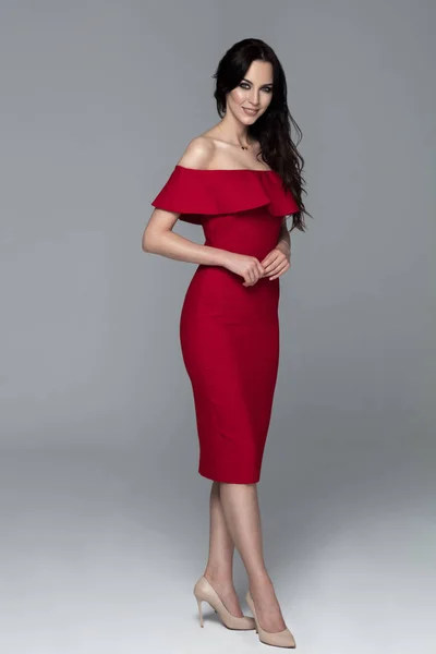 https://st3.depositphotos.com/2056297/16920/i/450/depositphotos_169207942-stock-photo-beautiful-woman-in-red-dress.jpg