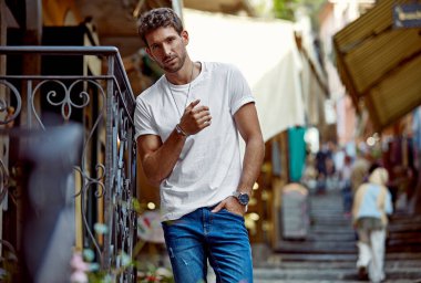 Handsome man in daily outfit looking at camera