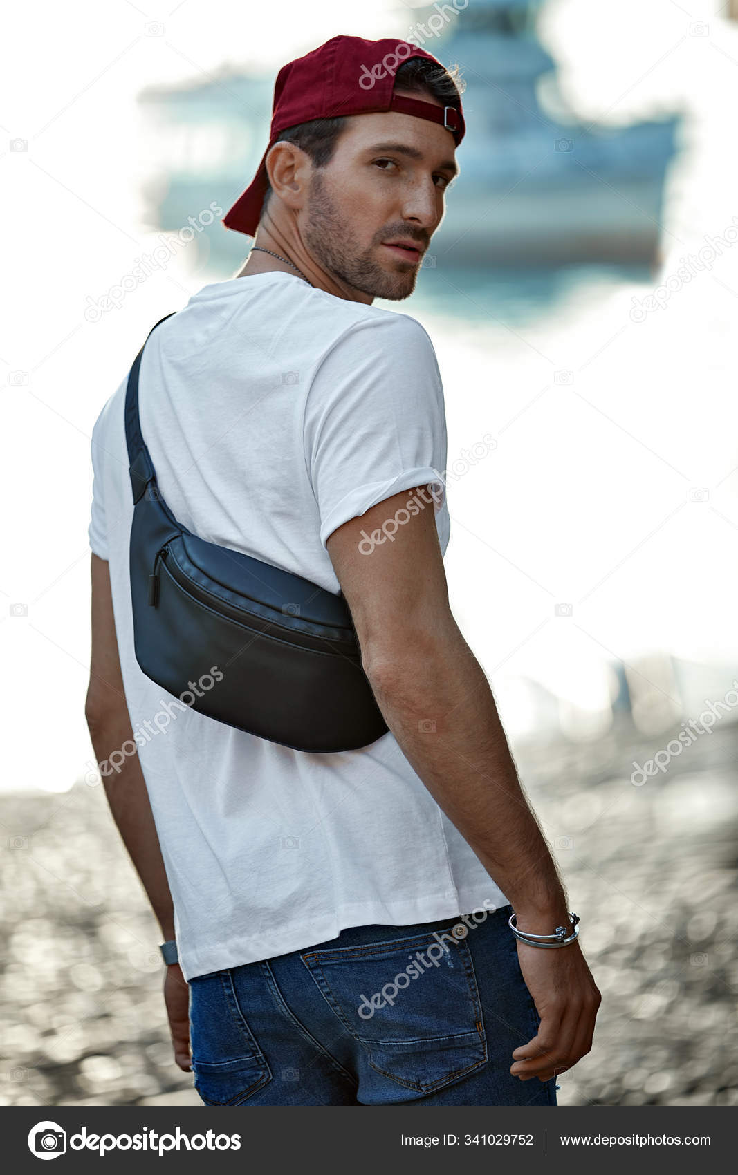 Handsome man in daily outfit wear bum bag Stock Photo by ©kiuikson 341029752