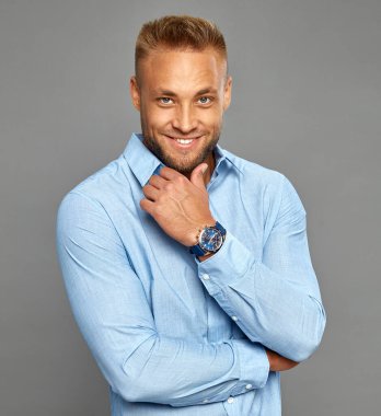 Sexy handsome mam wear watch and smiling to the camera