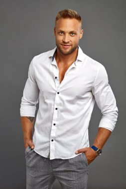 Handsome man wear white shirt isoalted on gray background