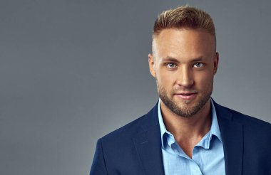 Portrait of handsome man in suit with copy space  