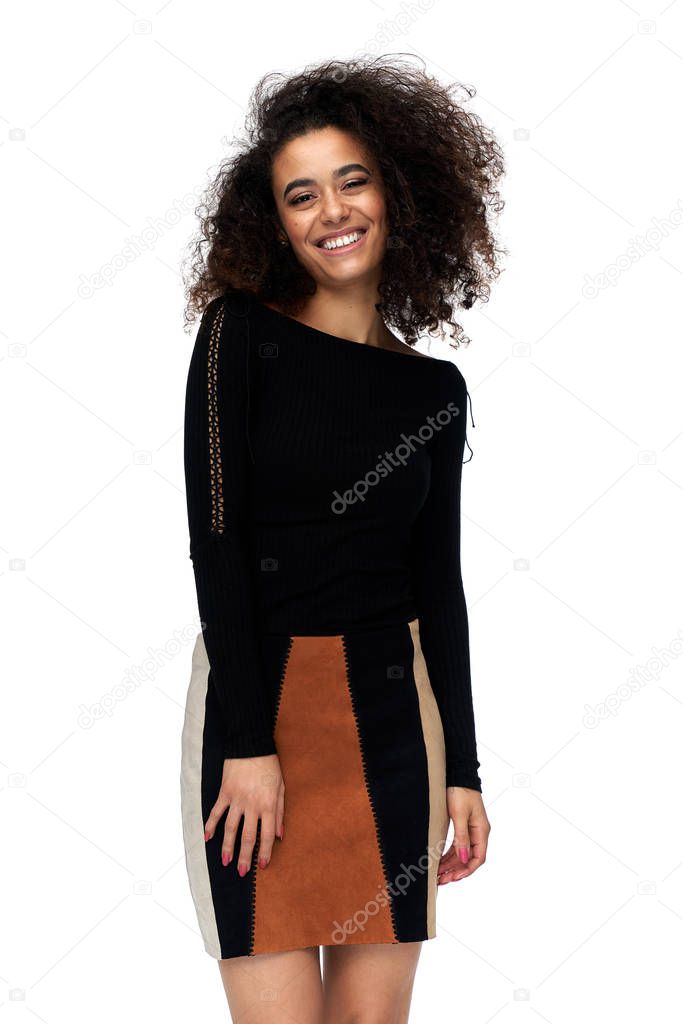 Cheerful latin american woman with afro hairstyle isolated on white