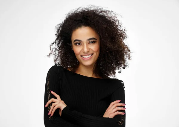 Cheerful latin american woman with afro hairstyle isolated on wh — Stock Photo, Image