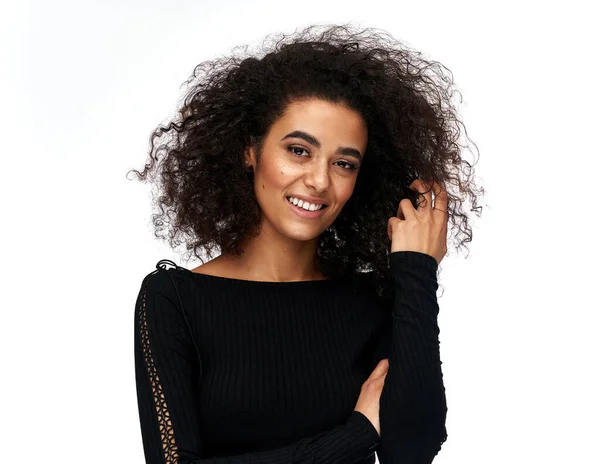 Cheerful latin american woman with afro hairstyle isolated on wh — Stok fotoğraf