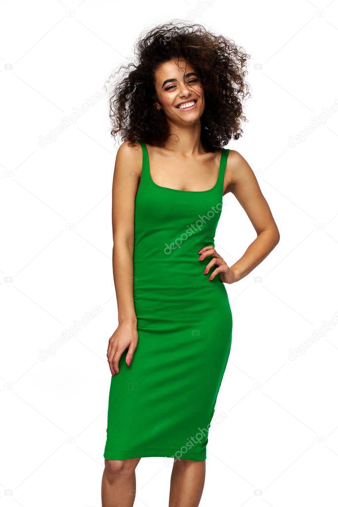 Cheerful latin american girl wear green dress isolated on white 