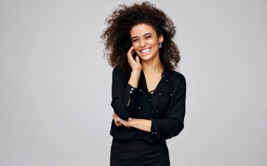 Portrait of cheerful african american woman with freckles and af