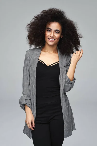 Beautiful cheerful latin american woman wear gray jacket isolate — Stock Photo, Image