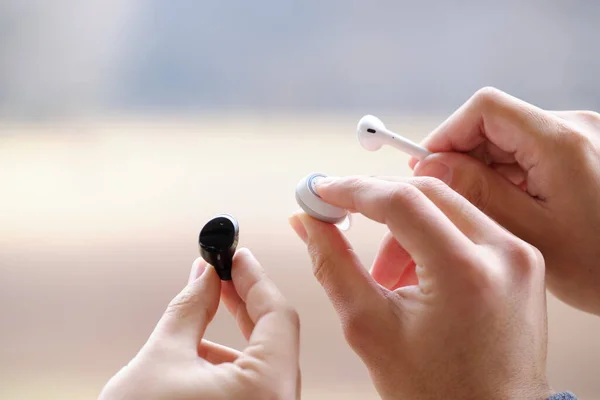 Comparing Three Wireless Earbuds — Stock Photo, Image