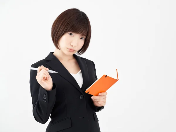 Une Employée Bureau Japonaise Prend Des Notes Sur Fond Blanc — Photo