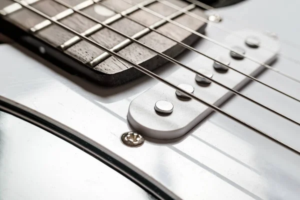 Body and neck with strings of a modern, electronic guitar, close-up. — Stock Photo, Image