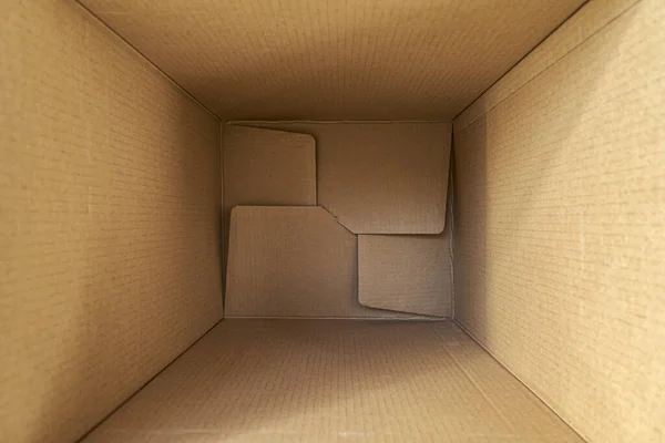 Opened empty cardboard box, with copy space. Delivery concept. Top view. — Stock Photo, Image