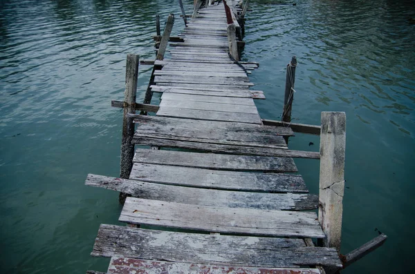 Wooden pier on the sea background — Stock Photo, Image