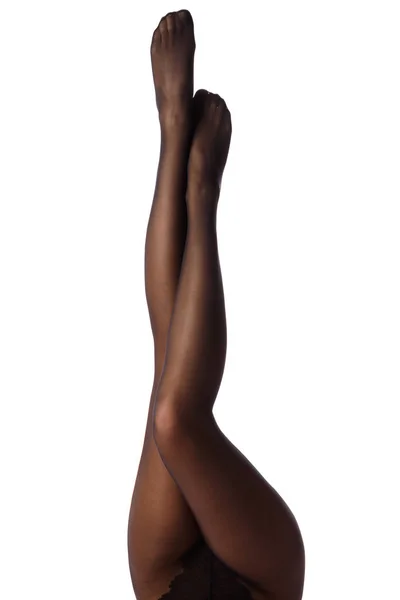 Женские ноги в черных колготках — стоковое фото