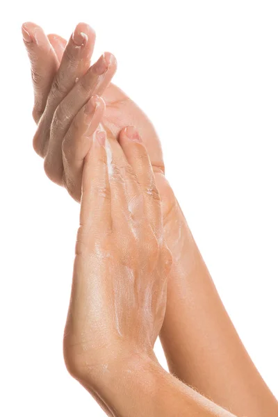 Female hands and moisturizing cream — Stock Photo, Image