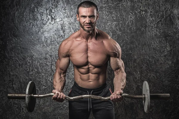 Bodybuilder with barbell — Stock Photo, Image